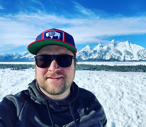 Nick in front of mountains at Tetons