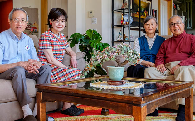 Wu and his wife, Hing, sit with the Lees in Wu s home in Bellingham, Washington 