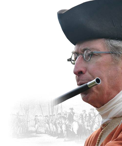 Hafner playing Flute in historical minuteman outfit