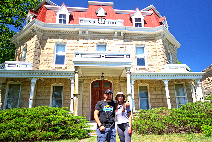 Marco and Sandra in front of house