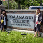 Students in front of Kalamazoo College sign