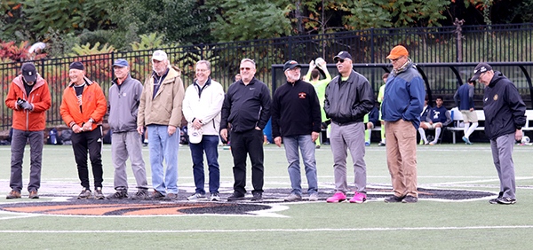 1975 Soccer team standing on field