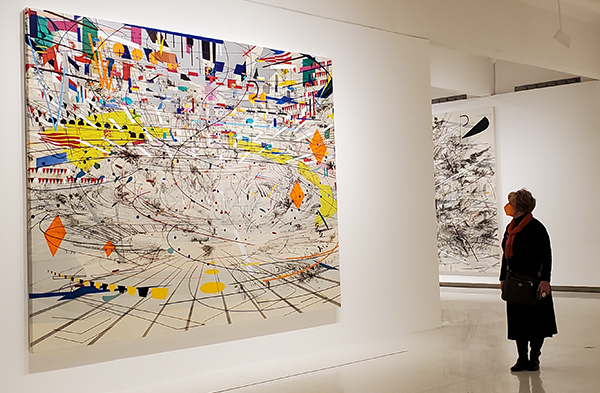 artwork of Julie Mehretu hanging on a gallery wall