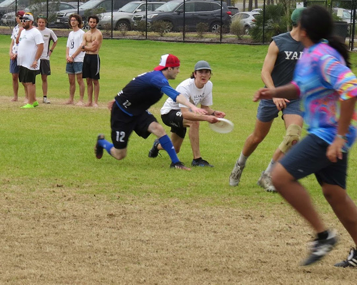 Tommy Saxton '22 looks to pass in a High Tide tournament game against Yale.