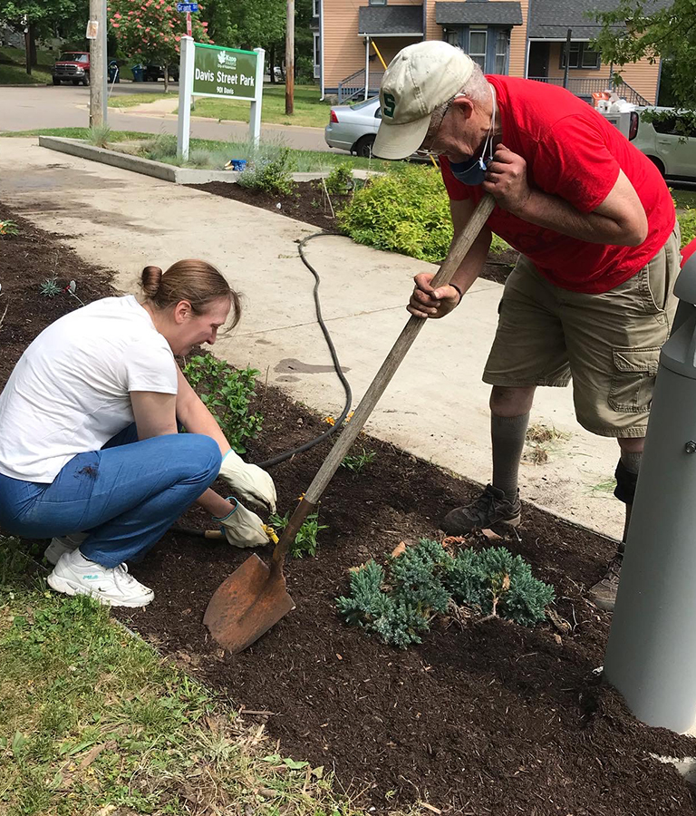 Kim Cummings planting a garden