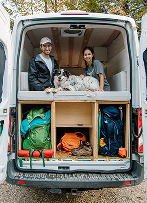 Simone Arora ’15, her fiancé Nick, and their dog, Charlie, in her renovated van.
