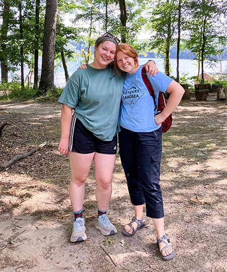 Two students at a campsite