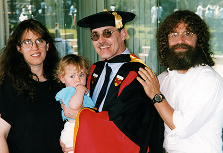 Meijer in his graduation garb with his the Sapolsky family