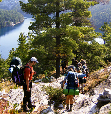 Students in backpacking gear on a hike
