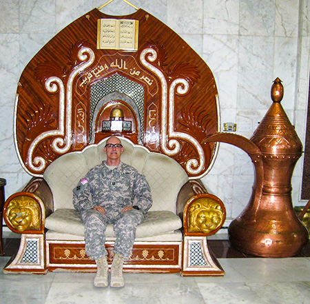 Meier on a palace chair in Baghdad