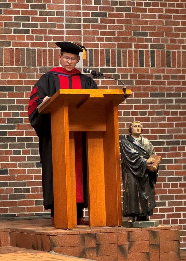 Nathan Allen '02 delivering a sermon