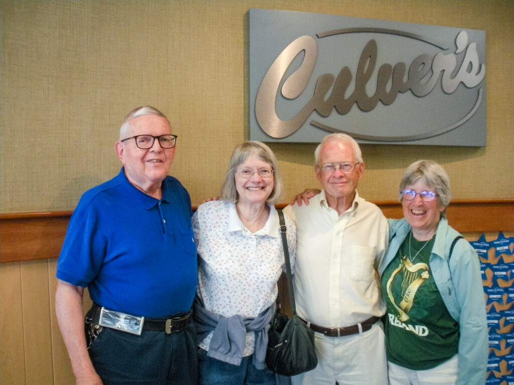 Ken and Louise Van Andel, along with Dennis and Pat Lamb, posing in front of a Culver's restaurant sign.