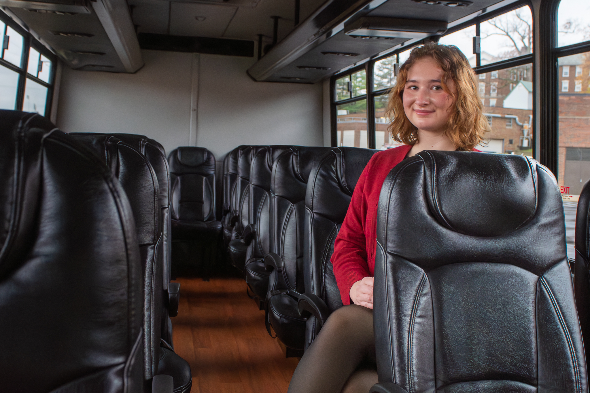 Sage Lewis '25 inside a bus