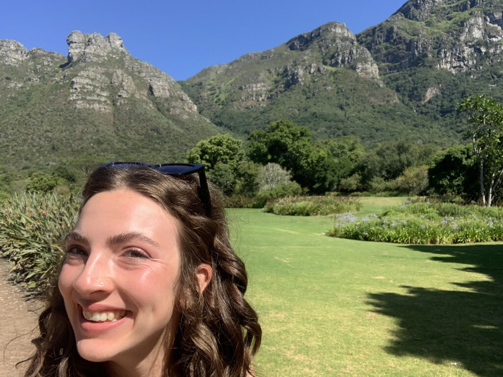 Elle Waldron '23 poses for a selfie with a breathtaking view of the mountains in Cape Town, South Africa.