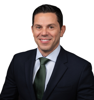 A professional headshot portrait of Matthew Conti, Chief Human Resources Officer at Chemours and Kalamazoo College alumnus, smiling warmly. He has short dark hair, a neatly trimmed beard, and wears a navy blue suit jacket, light blue dress shirt, and green tie against a plain white background.