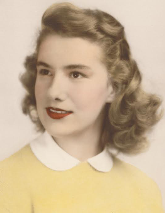 A vintage-style colorized portrait of Marguerite A. Johnson from the class of 1950. She is shown from the chest up, looking slightly off-camera with a gentle smile and red lipstick. Her blonde hair is styled in classic 1940s-era waves, and she is wearing a bright yellow sweater with a white Peter Pan collar against a neutral, light-colored background.