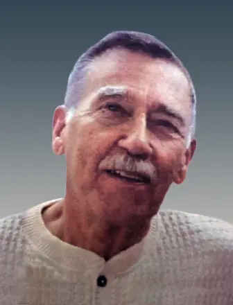 
Gemini said
A portrait of John Alexander McColl from the class of 1953. He is an older man with a mustache and short, salt-and-pepper hair, shown from the shoulders up with a slight smile. He is wearing a light-colored, textured sweater with a buttoned collar, set against a simple gradient background of grey and blue.