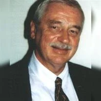 
Gemini said
A portrait of Richard H. Matthews, a man with light-colored hair and a gray mustache, wearing a dark suit jacket over a white dress shirt and a patterned necktie. He is smiling slightly toward the camera against a plain, light-colored background.
